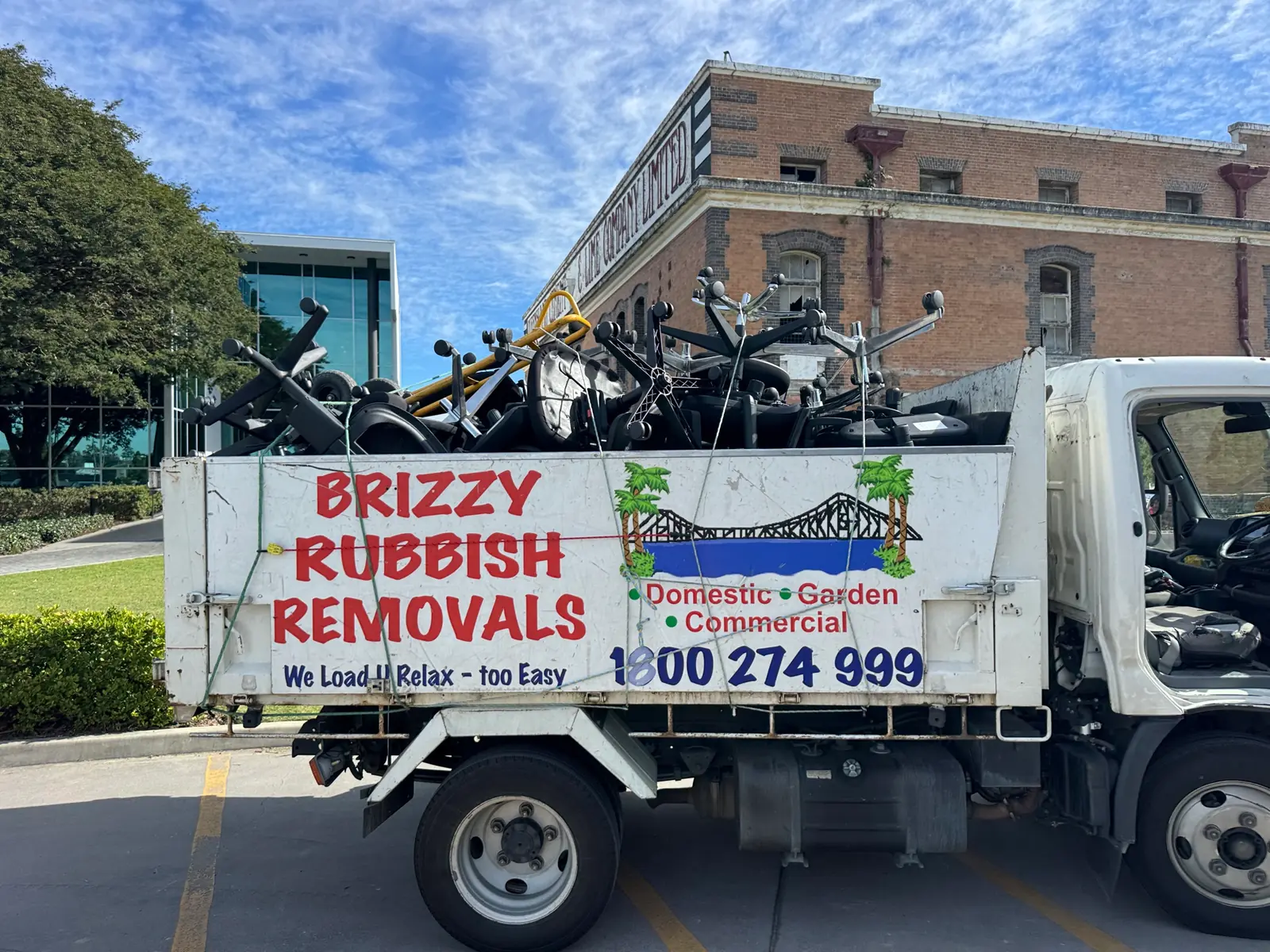 Brizzy Rubbish Removals truck loaded with office chairs for furniture removal in Brisbane