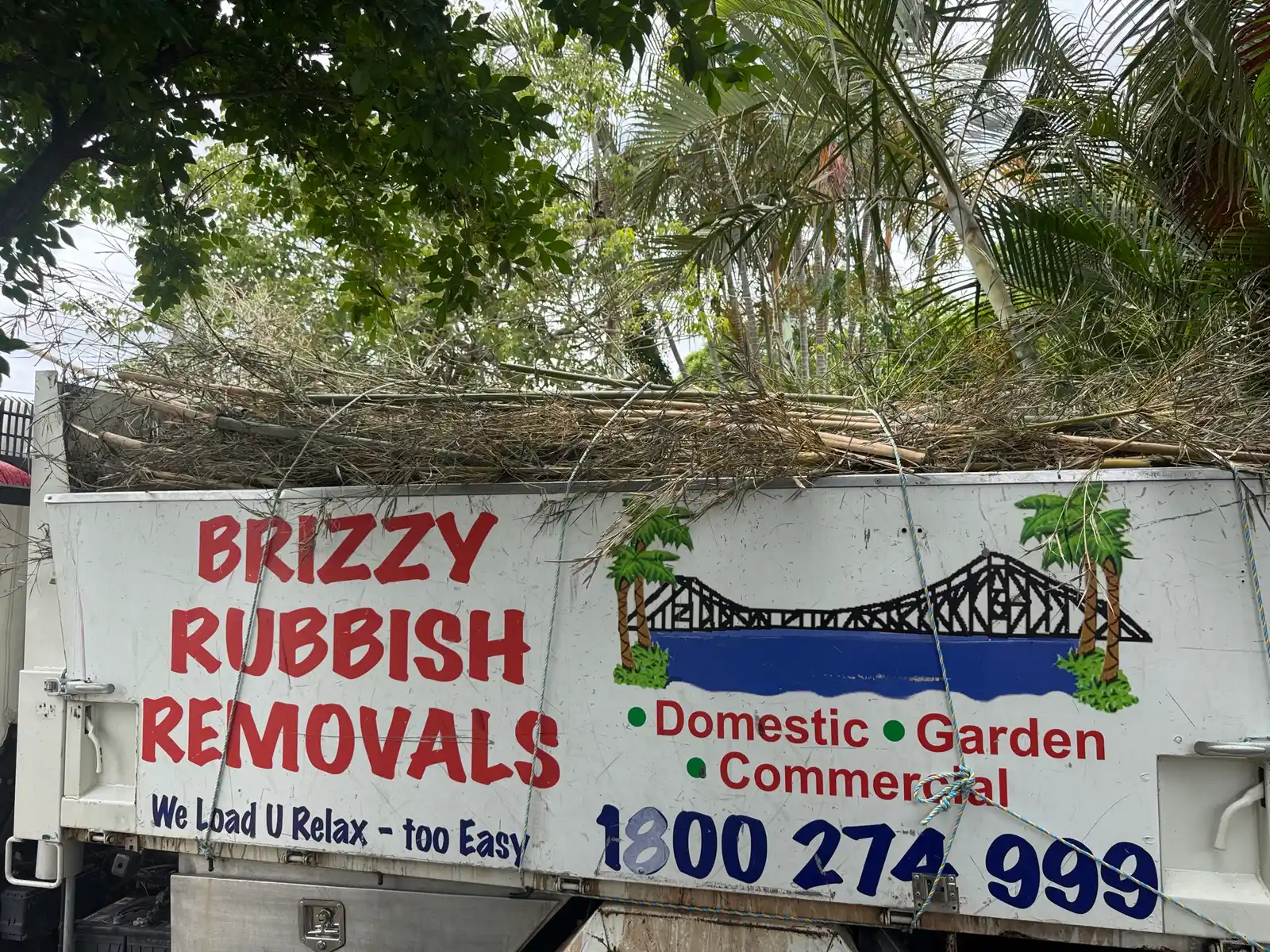 Brizzy Rubbish Removals truck loaded with green waste in Ashgrove
