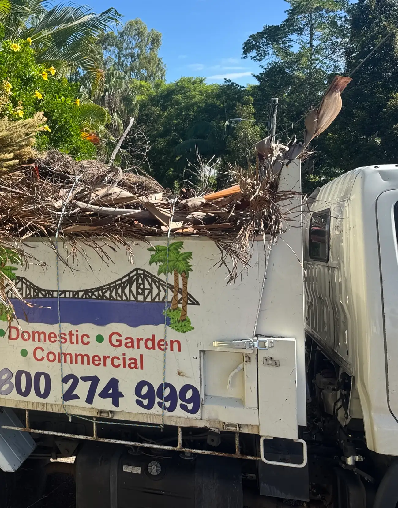 Truckload of garden waste and branches for green waste removal in Brisbane