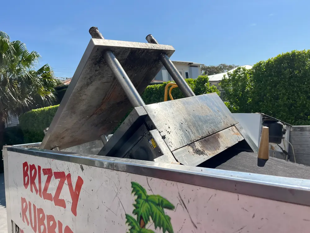 Commercial stove loaded onto Brizzy Rubbish Removals truck in Hawthorne