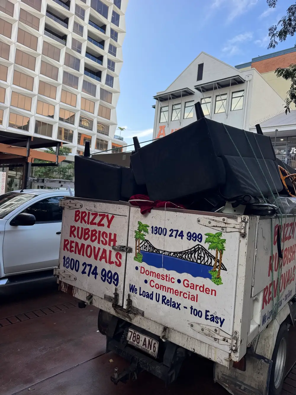 Office furniture cleared and loaded for rubbish removal in New Farm